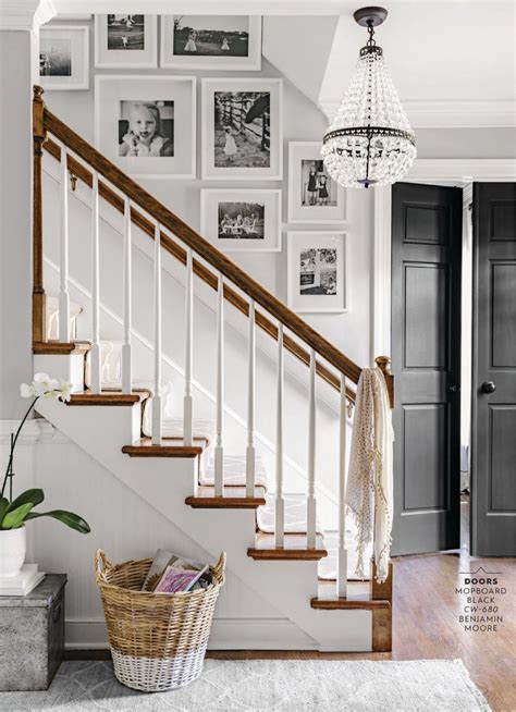 The north black door of opportunities. Farmhouse renovation upstate - Foyer with black door and ...