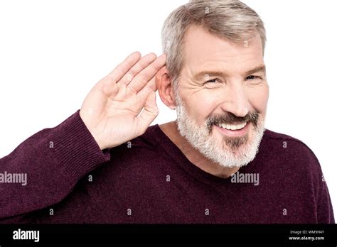 Mature Man Cupping Hand Behind Ear Stock Photo Alamy