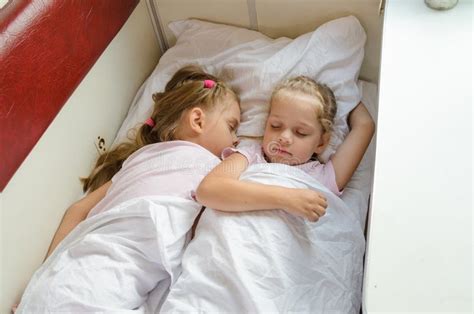 Sisters Sleep On A Cot In A Train Stock Photo Image 68317480