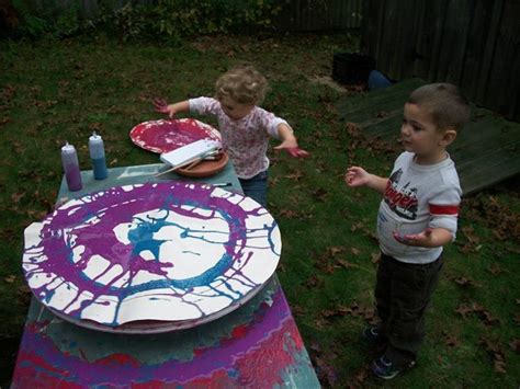 Through stimulating art activities, educators and parents can harness children's natural inquisitiveness. Spin art using a bicycle wheel at 'Garden Gate Child ...