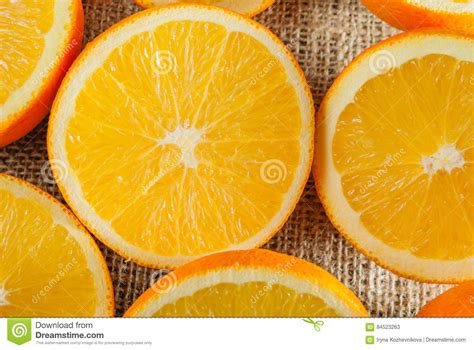 Oranges Fruits And Orange Slice On Wooden Table And Retro Fabric Stock
