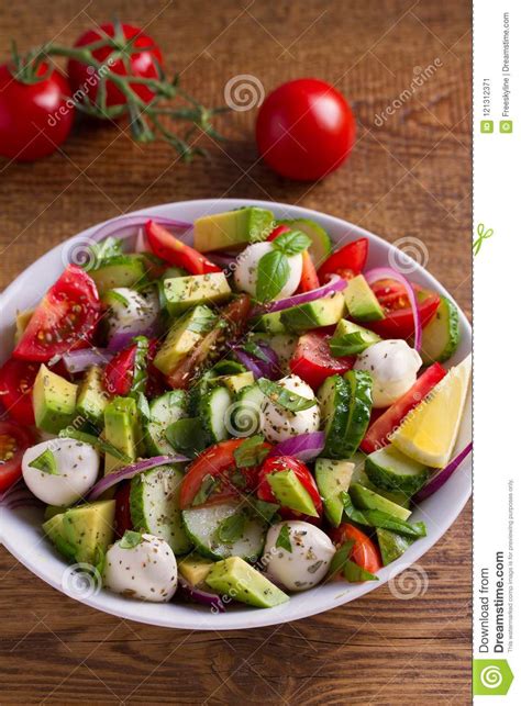 Instructions in a large bowl, combine halved red and yellow cherry or grape tomatoes, diced avocado, sliced cucumber, diced red onion, small fresh mozzarella cheese balls. Avocado, Tomato, Cucumber Salad With Mozzarella Cheese ...