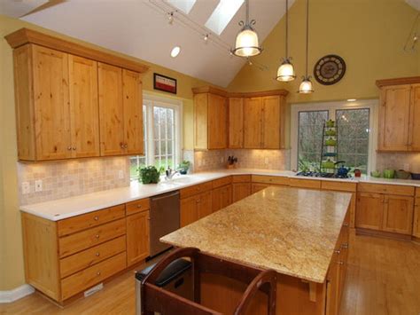 What color did you use? Paint Color in Kitchen with Hickory Cabinets