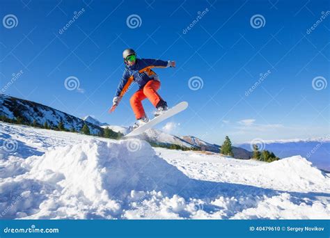 Snowboarder Jumping High From Hill In Winter Stock Photo Image Of