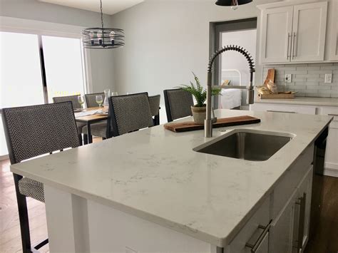 You may be drawn to a certain look, but it's important to also think. This spring-loaded faucet is perfect for this kitchen ...