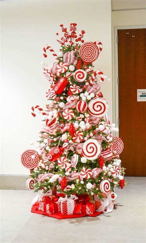 A Christmas Tree Decorated With Red And White Candies Lollipops And