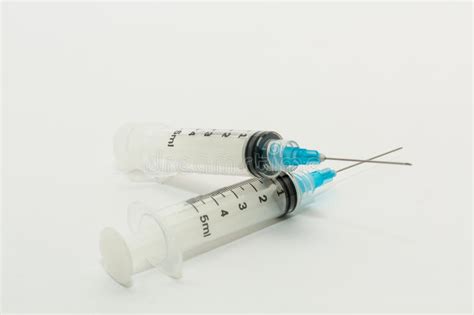 Two 5ml Disposable Syringes With Blue Needles Stock Image Image Of