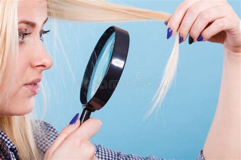 Woman Looking At Hair Through Magnifying Glass Stock Photo Image Of