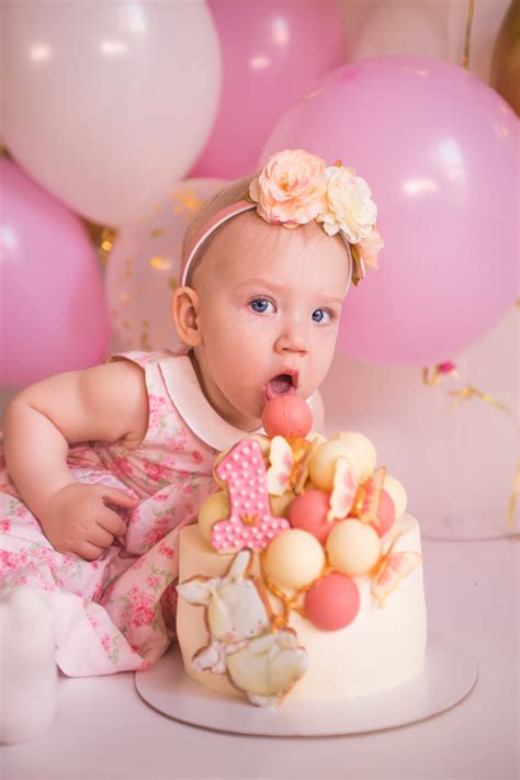 Baby In Pink Floral Dress And Birthday Cake · Free Stock Photo