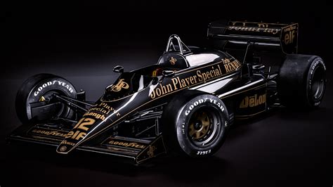 A Black And Gold Race Car On A Dark Background