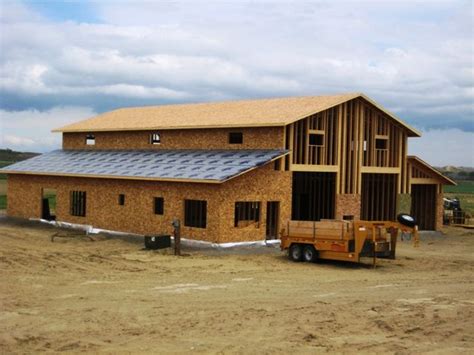 Detached garage plans designed to include finished living quarters are called garage apartment plans. Horse Barns with Living Quarters | framing up two story ...