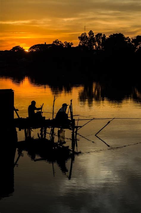 Two Fisherman Silhouette Against Sunset Stock Image Image Of Nature