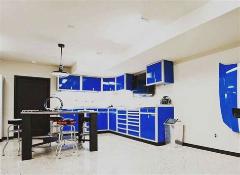 The cabinets go great with the custom floor and car lift. Gallery of Garage & Shop Aluminum Cabinets | Moduline
