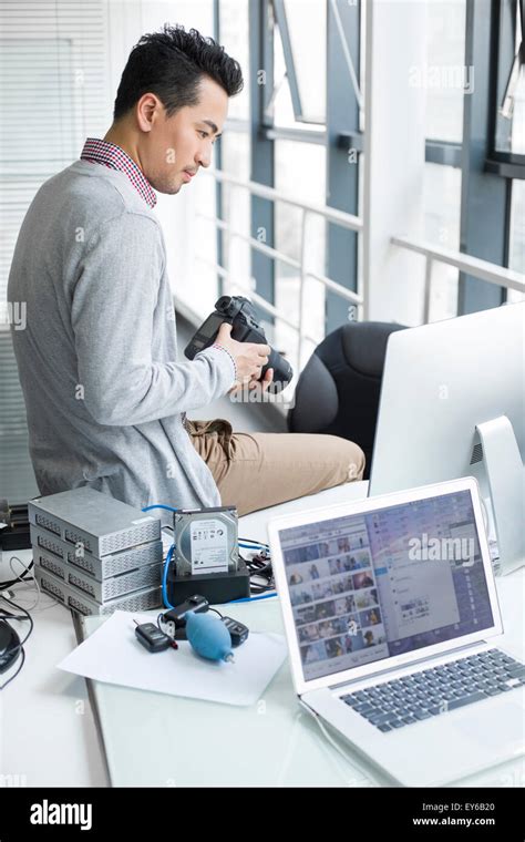 Male Photographer Working In Office Stock Photo Alamy