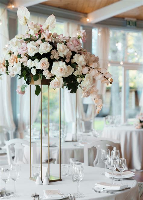 29 Tall Centerpieces That Will Take Your Reception Tables To New