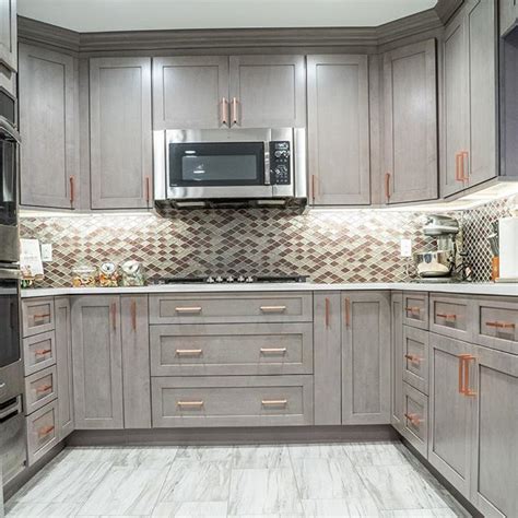 Long, lean brass and gold good theflooringgirl.com. Grey Fabuwood kitchen cabinets with copper hardware # ...