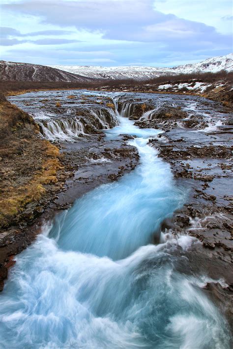 Cascades And A Raging Turquoise River Can Be Seen In The Golden Circle