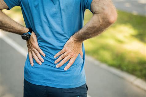 Why Does My Lower Back Hurt When I Stand Too Long? - LI Spine