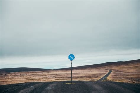 Picture Of Dark Dirt Road With Sign — Free Stock Photo
