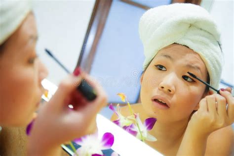 Young Happy And Beautiful Asian Chinese Woman At Home Or Hotel Bathroom
