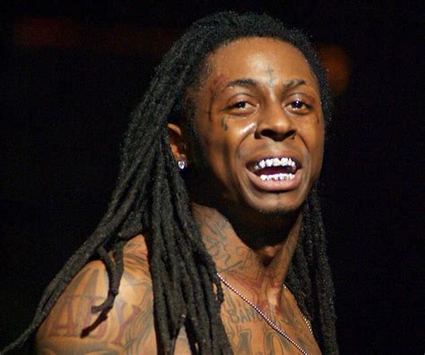 Lil wayne goes all out with full coverage with teeth diamonds on the front teeth and the gold halo around them. Rhymes With Snitch | Celebrity and Entertainment News ...