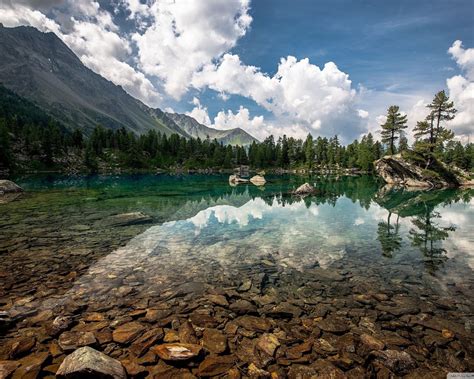 Natural Beauty Mountain Lake With Crystal Clear Water Bottom With