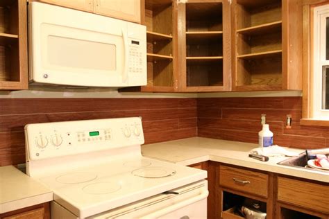 Create a rustic farmhouse accent wall in your home. Faux Shiplap Backsplash with Peel 'n Stick Flooring