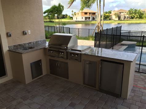 L Shaped Outdoor Kitchen With Alfresco 30 Grill And Double Side Burner