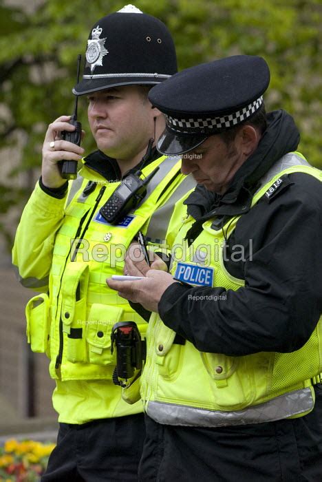 West Midlands Police Officer And A Pcso Writing Notes