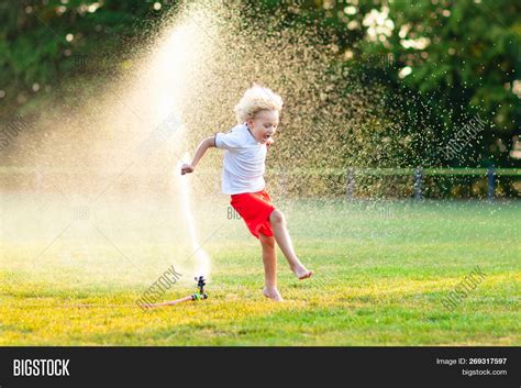Kids Play Water Child Image And Photo Free Trial Bigstock