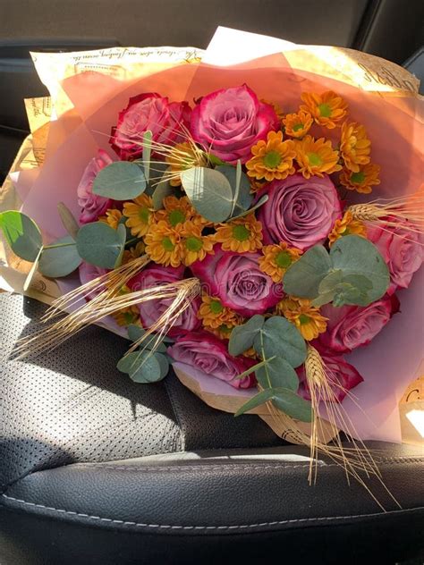 Beautiful Bouquet Of Rose Flowers In Car Flower Delivery Service Stock