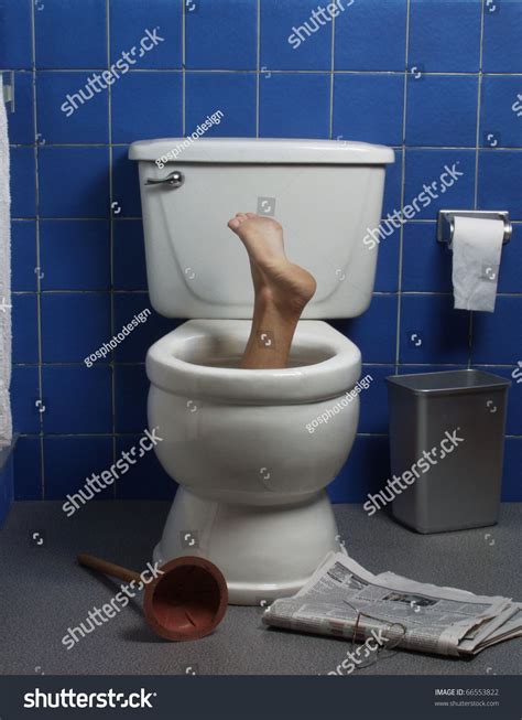 foot reaches up through the seat from out of a toilet in a domestic bathroom toilet homemade