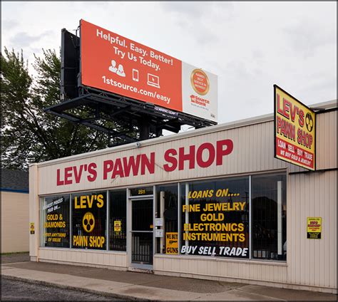 Banking for rich and poor | Bank billboard above a pawn shop