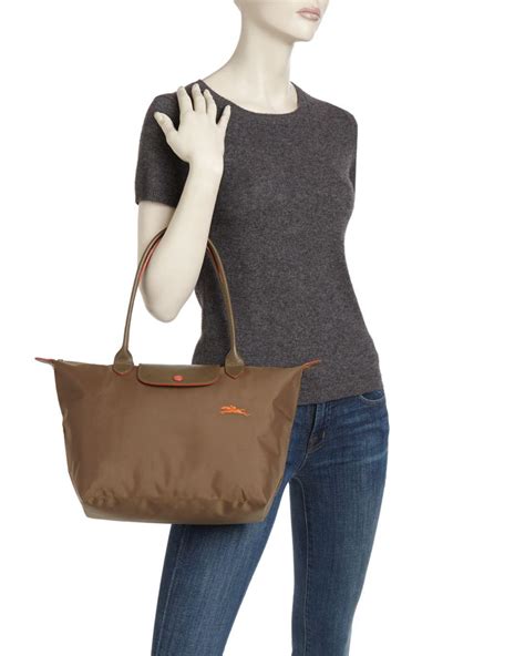 The le pliage bag from longchamp is the brand's most iconic style. Longchamp Le Pliage Club Medium Shoulder Tote - Lyst