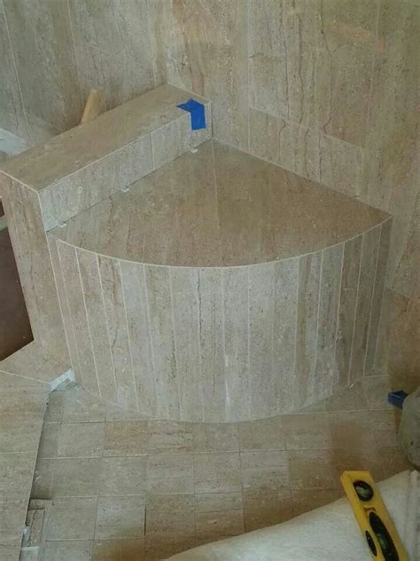 I had to put little pads under the feet to stop the ring lines and they just look ridiculous. Radius corner bench in a master shower | Corner shower ...