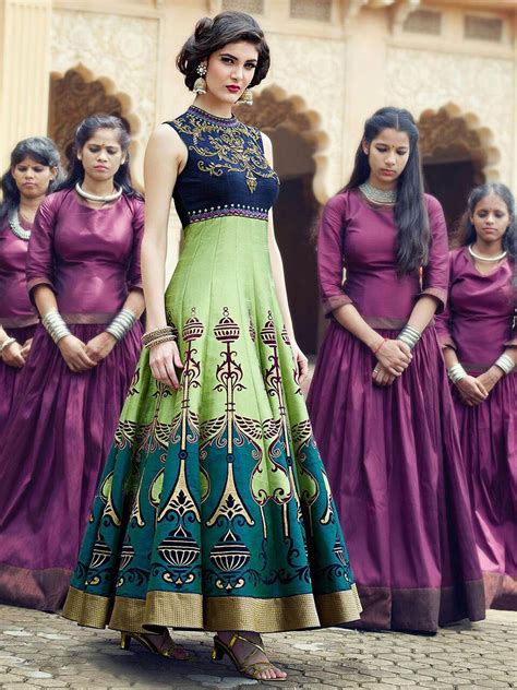 Anarkalis are long gown style dresses that are generally bell shaped, worn with pants and have a matching dupatta. Graceful green and blue fusion silk gown anarkali ensemble ...