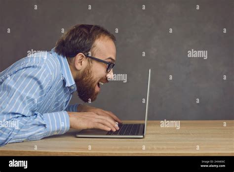 Funny Caucasian Man Typing Fast On Laptop Keyboard Playing Video Game