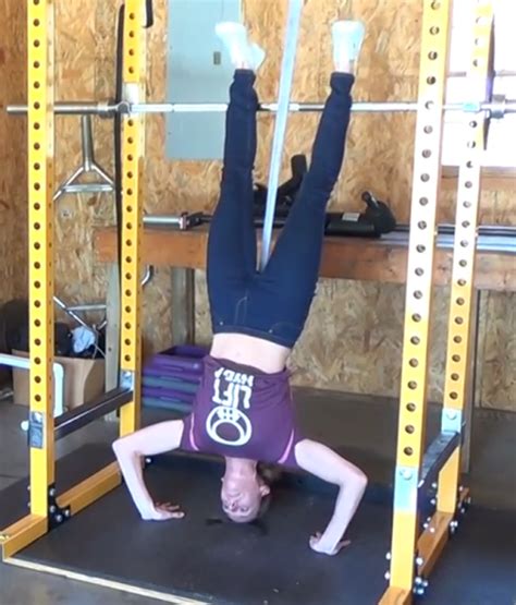 How To Perform Assisted Handstand Push Ups