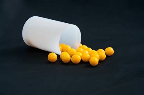 110 Little Yellow Pill With A V On It Stock Photos Pictures And Royalty