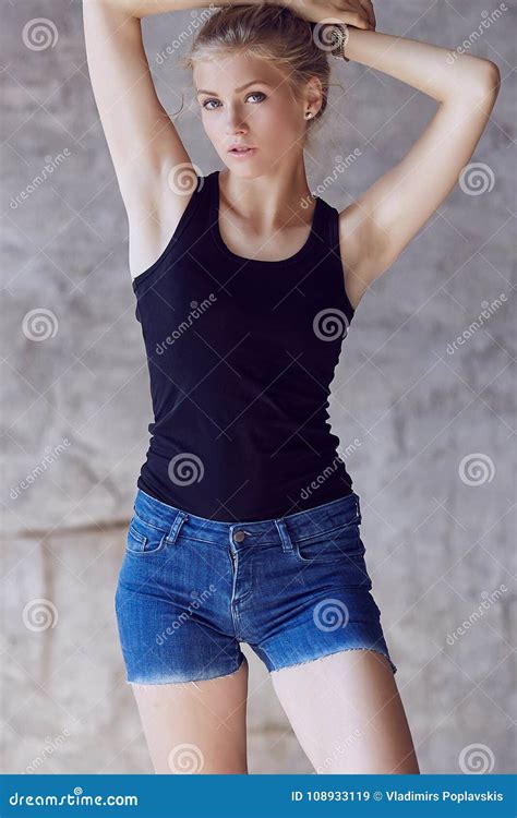 blond girl in denim shorts and black shirt stock image image of female natural 108933119