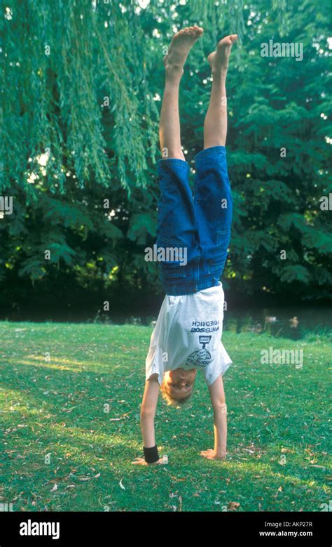 Young Boy Doing A Handstand Stock Photo Alamy