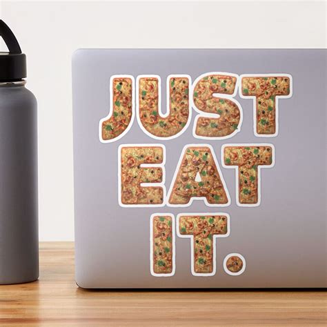 A Sticker That Says Just Eat It Next To A Water Bottle On A Table