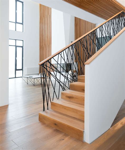 A Decorative Stair Railing With A Modern Design