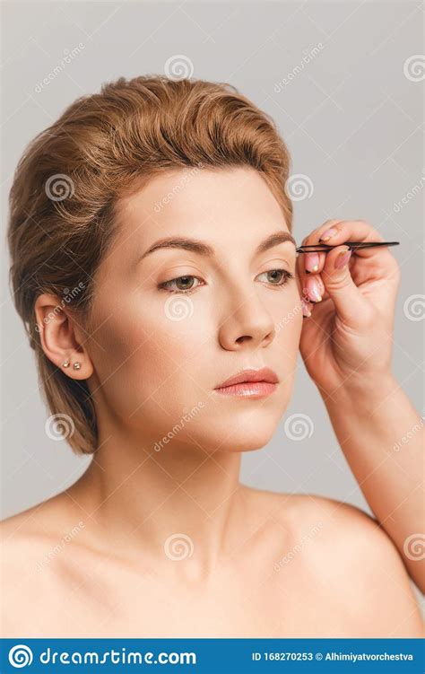 Eyebrow Correction With Tweezers Blonde Model Face With Makeup Nude