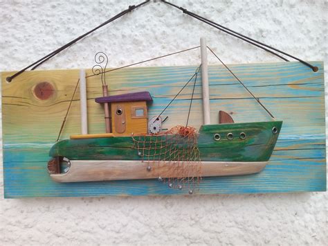 Fish's body is made of capiz shell in a textured ruffled design, glisten in gold, sea greens and blues, and the inlaid capiz face is smooth and shimmery. Handmade wooden fishing boat / Wall Hanging boat / Wooden ...