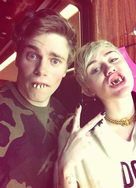Miley Cyrus And Olympic Hottie Gus Kenworthy Flash Creepy Teeth During