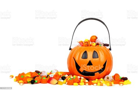 Halloween Jack O Lantern Bucket Filled With Candy Isolated On White