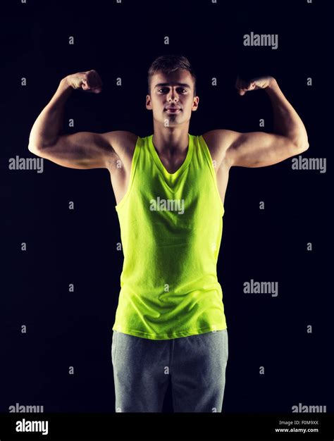 Young Man Showing Biceps Stock Photo Alamy