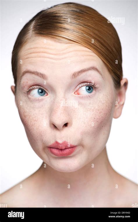 Young Woman Pursing Lips Stock Photo Alamy