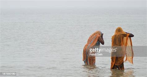 river bathing indian women photos and premium high res pictures getty images